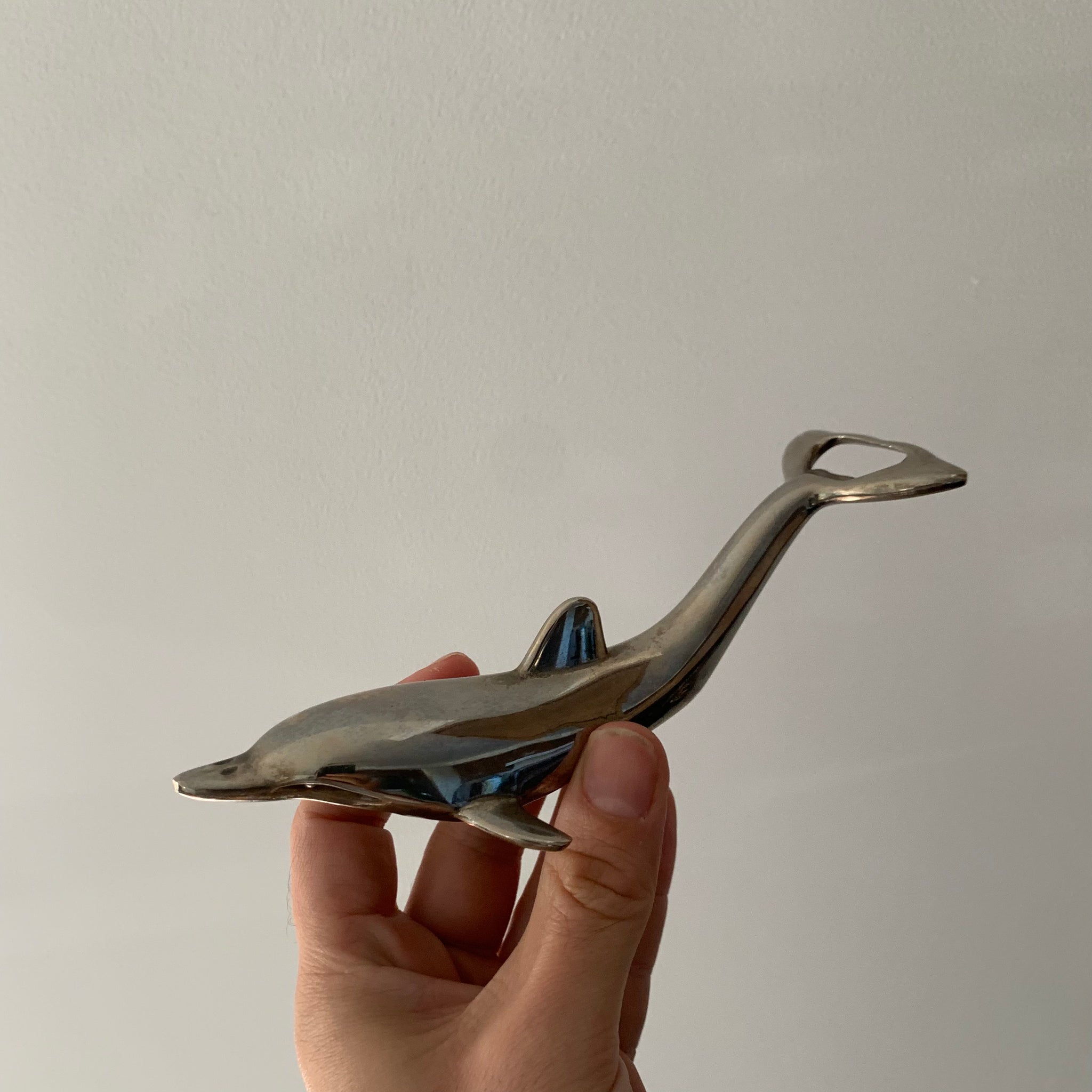 Silver bottle opener dolphin